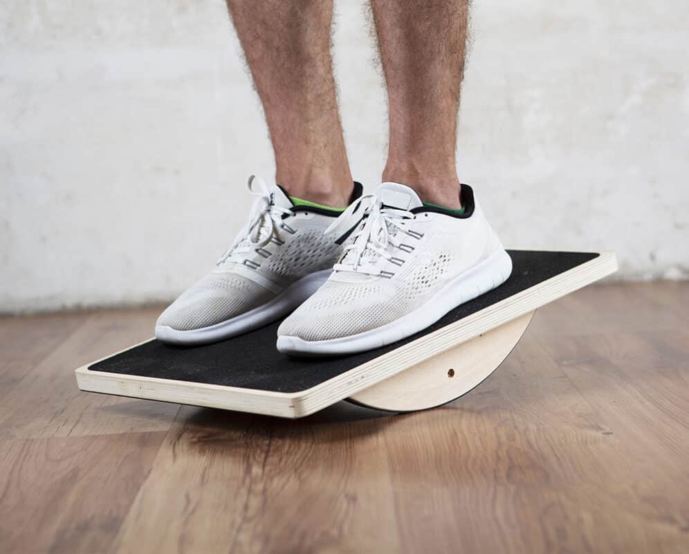 model on wooden balance board